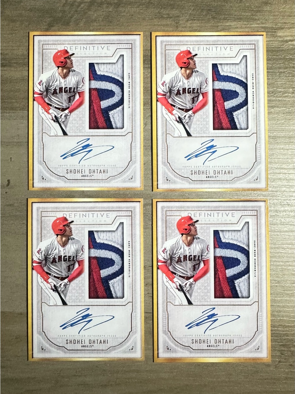 Shohei Ohtani Lot of (4) 2021 Topps Definitive Signed Patch Novelty Cards.